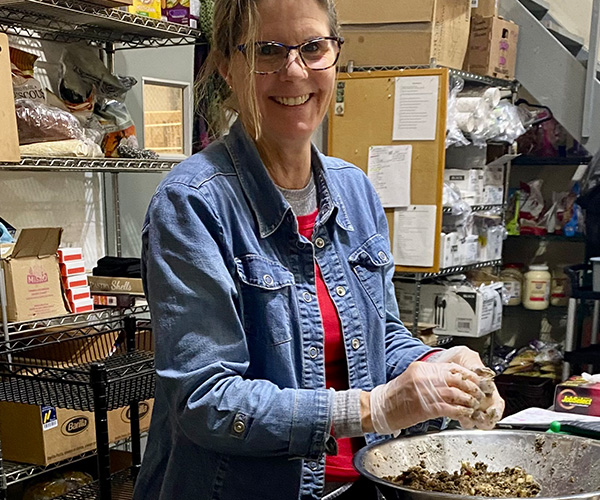 Healthy Cafe Catering Co. Sous Chef Robin Snavely prepping food