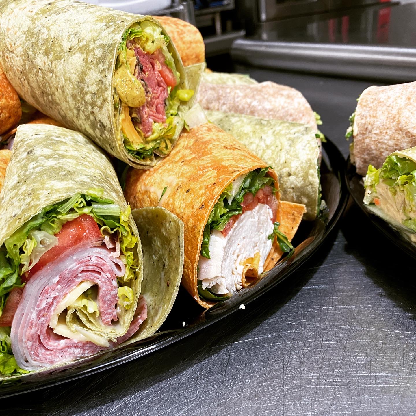 deli platter of assorted specialty wraps