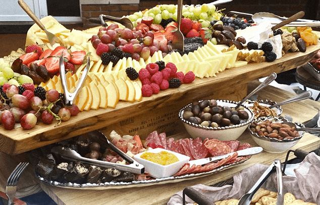 fresh fruit and charcuterie board at a catered corporate event